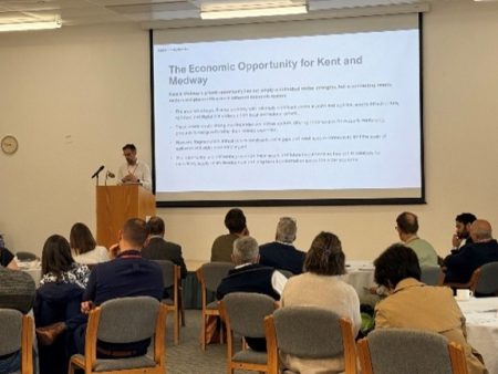 Stakeholders attending a Local Growth Plan workshop in Kent and Medway with presentation displayed at the front of the room